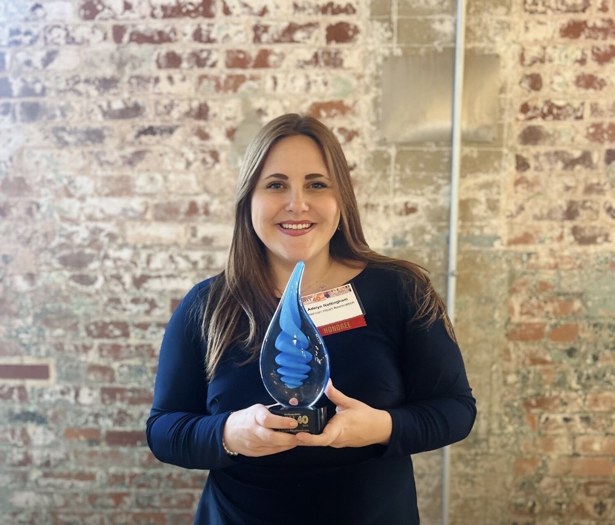 Adelyn Nottingham receiving the 40 Under 40 award from SC Biz News