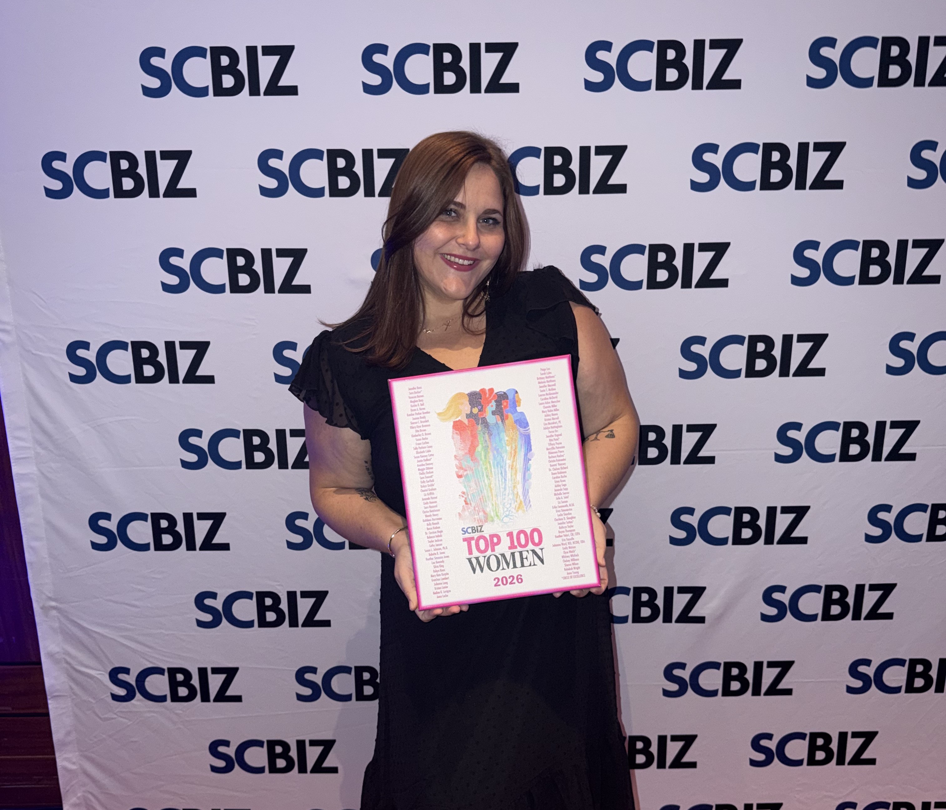 Adelyn Nottingham receiving Top 100 Women in SC recognition from SCBIZ